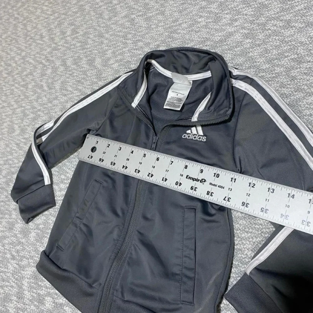 Adidas black & gray jacket with white stripes on sleeves kids size 4. SKU-B191
